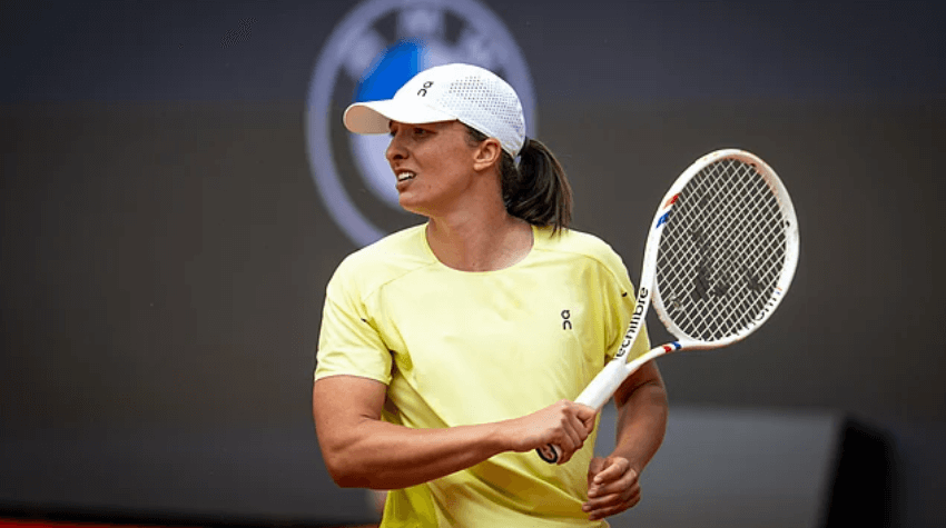 Poland's Iga Swiatek smiles while having a short lull in practice ahead of the Italian Open. Swiatek, Gauff eye Vatican amid Italian Open stint; Kvitova wins