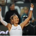 China's Qinwen Zheng raises her arms in celebrationafter her match against Aryna Sabalenka in Rome on Wednesday. Zheng stuns Sabalenka in Italian Open; Alcaraz reaches semis