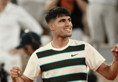 Spain's Carlos Alcaraz smiles for the crowd in his French Open quarterfinal vs American Tommy Paul on Tuesday. Alcaraz reaches French Open semis; Swiatek, Sabalenka in last 4