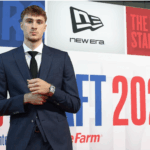 Duke forward Cooper Flagg poses for photographers after he was picked No.1 overall by the Dallas Mavericks at the 2025 NBA Draft on Wednesday. 2025 NBA Draft sees Flagg go No.1 at Dallas; Harper to Spurs