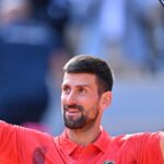 Serbia's Novak Djokovic raises his arms in triumph after his French Open quarterfinal against Alexander Zverev on Wednesday. Djokovic tops Zverev for French Open semis; Boisson in last four
