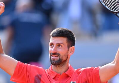 Serbia's Novak Djokovic raises his arms in triumph after his French Open quarterfinal against Alexander Zverev on Wednesday. Djokovic tops Zverev for French Open semis; Boisson in last four