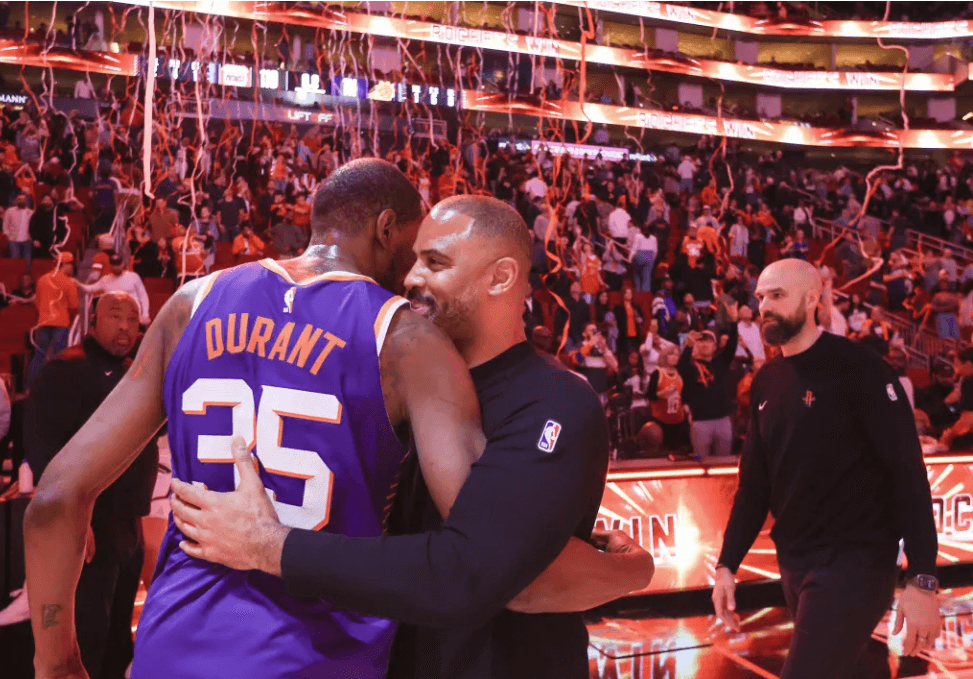 All-Star forward Kevin Durant (35, left) hugs Houston coach Ime Udoka (right) after a regular season game the past season. in file photo. Durant to join Rockets in blockbuster trade; Suns get Green