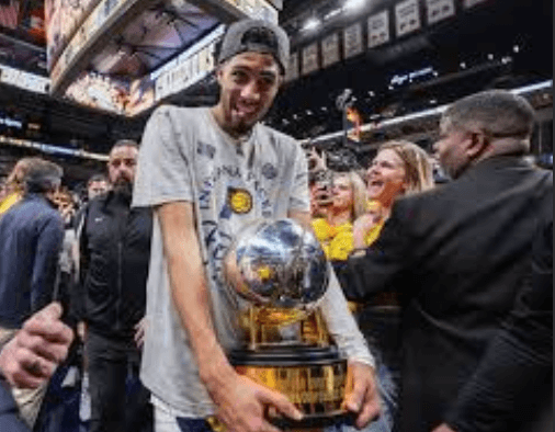 Pacers guard Tyrese Haliburton clutches the Eastern Conference Finals trophy after Indiana beat the New York Knicks, 4-2 , in their best-of-seven series . Pacers welcome underdog tag, 'best challenge' vs OKC in finals