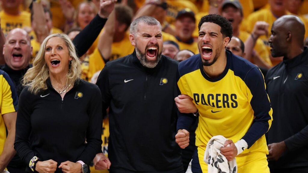 Indiana pointguard Tyrese Haliburton (right) roars with fans in the sidelines vs the OKC Thunder in Game 3 of the NBA Finals on Wednesday. Pacers vs Thunder series sees Indiana take Game 3 for 2-1 edge