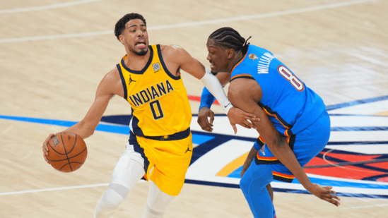 Indiana Pacers guard Tyrese Halliburton (0, left) struggles to get by defense of OKC forward Cason Wallace (8, right) in Game 2 of the NBA Finals vs the Indiana Pacers on Sunday, OKC vs Pacers Game 2 sees Thunder bounce back, tie NBA Finals