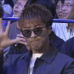 Unidsputed super bantamweight champion Naoya Inoue watches the Junto Nakatani -Ryosuke Nishida title fight in glasses on Sunday. Inoue 'welcomes' Nakatani to super bantamweight after TKO win