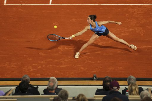 Frenchwoman Lois Boisson stretches to return a shot against Russian Mirra Andreeva in their French Open 2025 quarterfinal on Wednesday. Djokovic tops Zverev for French Open semis; Boisson in last four