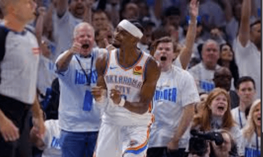 OKC guard Shai Gilgeous Alexander reacts to the crowd's approval in Game 1 of the NBA Finals against the Indiana Pacers on Thursday. Indiana vs OKC series sees Pacers steal Game 1 in NBA Finals