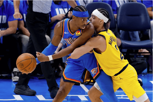 OKC pointguard Shai Gilgeous-Alexander (left) posts up against Indiana guard Andrew Nembhard (right) in Game 2 of the NBA Finals on Sunday, OKC vs Pacers Game 2 sees Thunder bounce back, tie NBA Finals